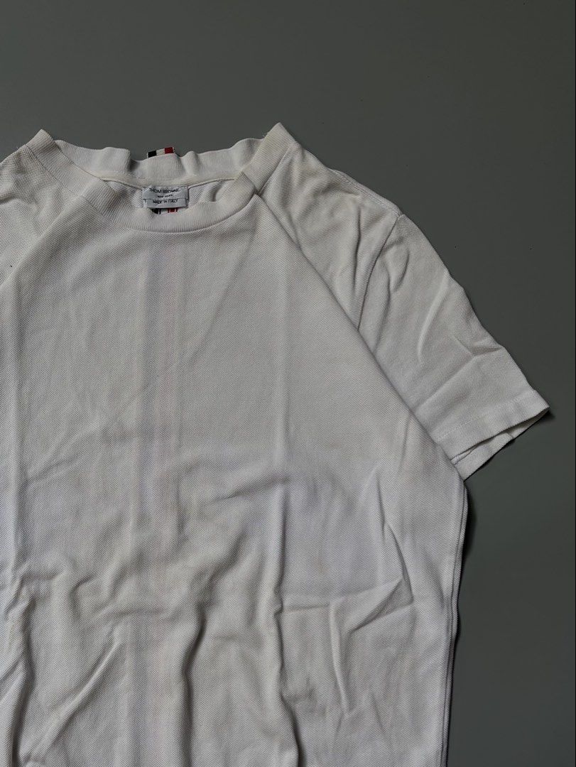Thom Browne Striped Back Shirt (Category: Luxury Apparel) located in Santa Cruz. Submitted by devbook1 (Listing ID 1457824402, Image 3). Description: Thom Browne Striped Back Shirt L: 27.5 W: 21.5 Excellent Condition Off/Legit *may parang napatakan ng konti ng zonrox ata yung sa may laylayan, look nalang po sa last pic but still presentable .