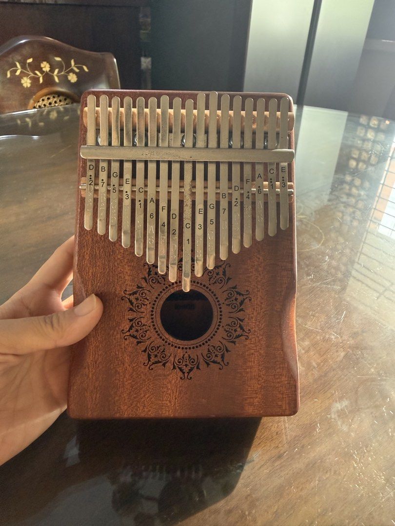 Thomson Wooden Kalimba (Category: Musical Instruments) located in Pasay City. Submitted by ninaamat (Listing ID 1457737384, Image 1). Description: Original Thomson Wooden Kalimba (Brown) Original price: P2000 Complete with original box, tuning tools, stickers, and tutorial booklet Perfect for song covers, instrument very easy to learn :) .