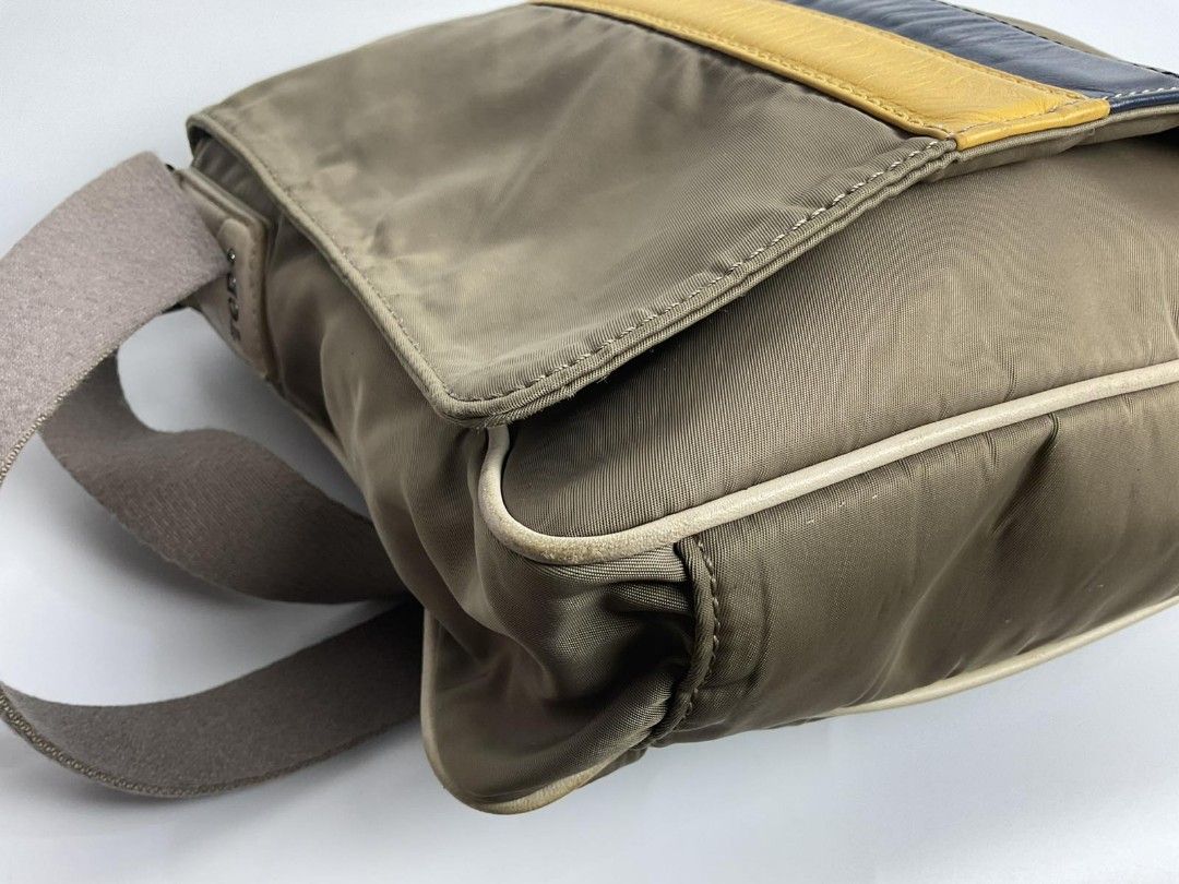 Tod's men's sling bag (Category: Luxury Bags & Wallets) located in Caloocan City. Submitted by siftedthriftedph (Listing ID 1457769293, Image 3). Description: Tod's nylon sling bag - Maganda quality, genuine leather trims, thick canvas strap - Signs of use, bawal sa maselan pls lang, pls check all pics - Bag is still very functional for everyday; Rare ang Tod's for men ❤️ - Pls self -authenticate - L-9.84in x H-7.87 in NO when worn pics.