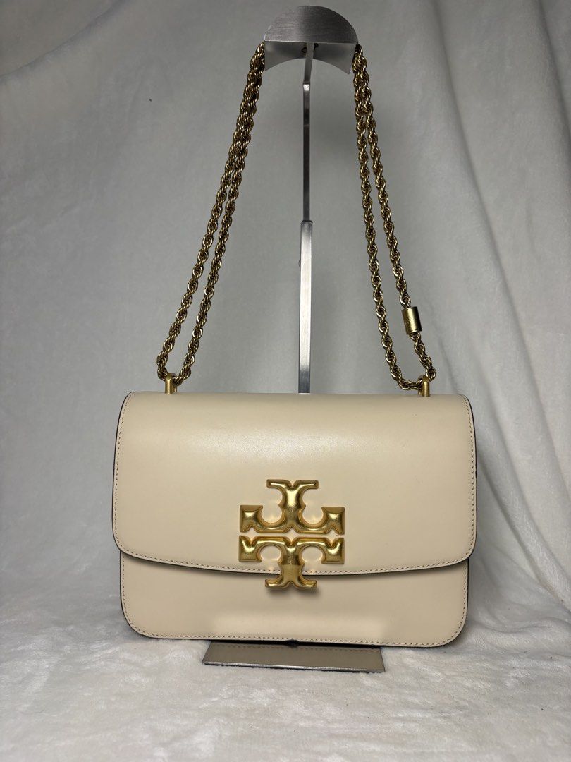 Tory Burch Chain Bag (Category: Luxury Bags & Wallets) located in Santa Rosa. Submitted by alinauy (Listing ID 1457759225, Image 1). Description: DETAILS • Authentic Tory Burch • Model: Eleanor • Color: Cream/Beige • Hardware: Gold-tone • Chain: Gold-tone • Material: Leather • Size: 18.5 cm × 6.5 cm × 13.5 cm • Condition: Like new • Inclusion: Dust bag only CONDITION • Please refer to all photos for the actual condition of the item. • Actual item