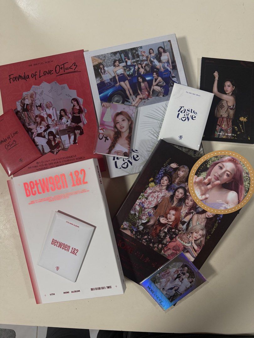 TWICE K-Pop Albums & Photocards (Category: K-Wave Merchandise) located in Quezon City. Submitted by microfficial22 (Listing ID 1457834578, Image 2). Description: - TWICE Albums & Photocards for Sale! - Albums included: Formula of Love: O+T=<3; Between 1&2; Taste of Love; More & More - Includes photocards and a sticker (not complete, but most of it included) - Perfect for any ONCE fan - All items are as shown in the photos (Posters included except