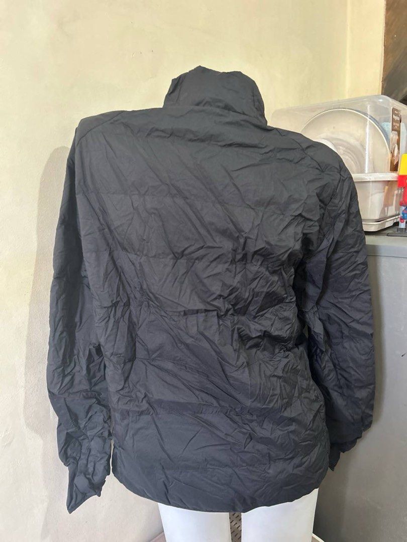 Uniqlo Ultra Light Down Jacket Size M Black (Category: Coats, Jackets and Outerwear) located in Manila. Submitted by wave.ceae (Listing ID 1457752460, Image 2). Description: - Uniqlo Ultra Light Down Jacket - Color: Black - Size: Medium (M) - Features water-repellent material - Extremely lightweight and warm - Comes with a compact pouch for easy storage and travel - Ideal for layering or wearing as a standalone piece.