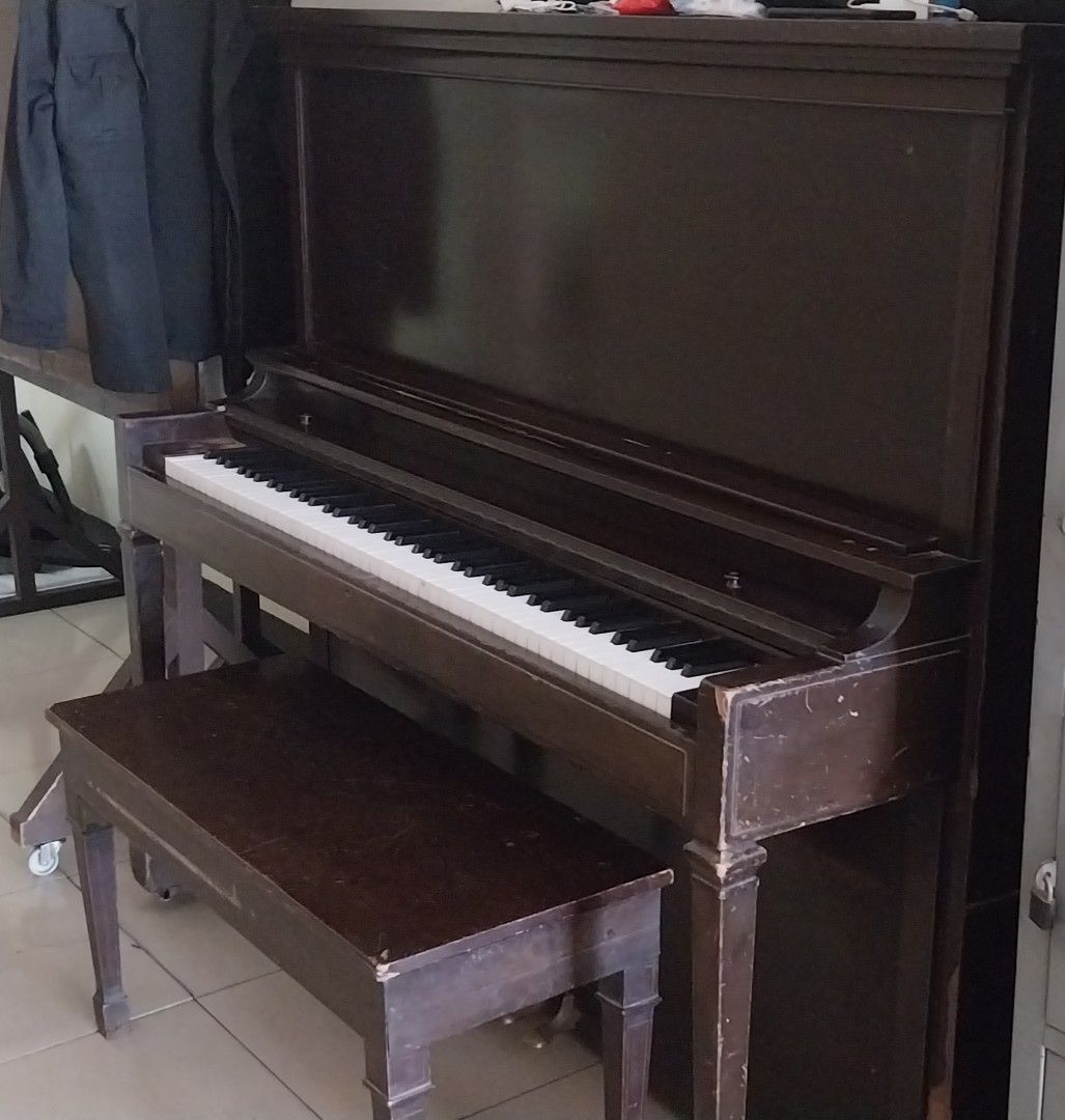 Upright Piano with Bench (Category: Musical Instruments) located in Cainta. Submitted by detheos7 (Listing ID 1457731689, Image 2). Description: -Negotable Price -(Working) Wooden upright piano - Includes matching bench - Features white and black keys - Beautiful decorative piece for home or studio - Ideal for beginners and practice sessions.