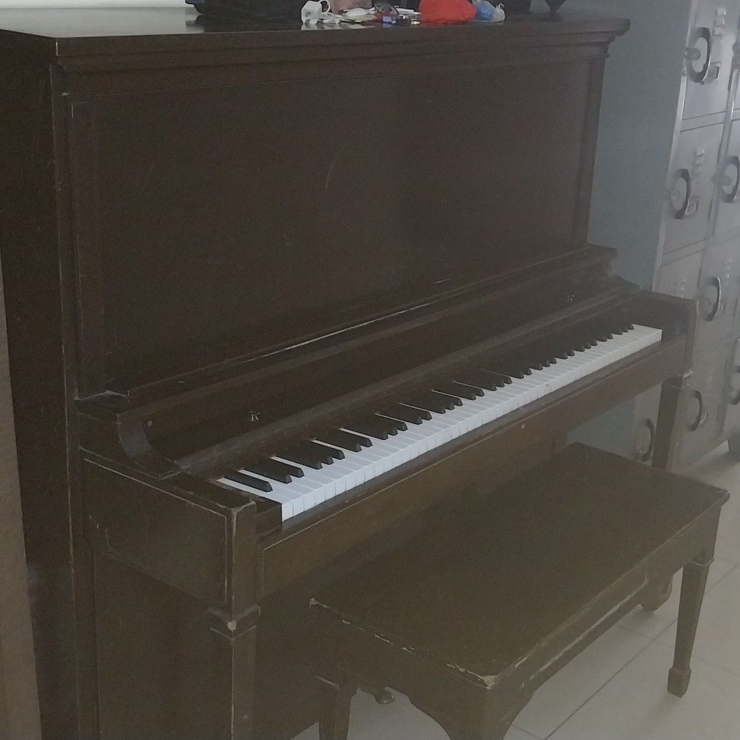 Upright Piano with Bench (Category: Musical Instruments) located in Cainta. Submitted by detheos7 (Listing ID 1457731689, Image 3). Description: -Negotable Price -(Working) Wooden upright piano - Includes matching bench - Features white and black keys - Beautiful decorative piece for home or studio - Ideal for beginners and practice sessions.