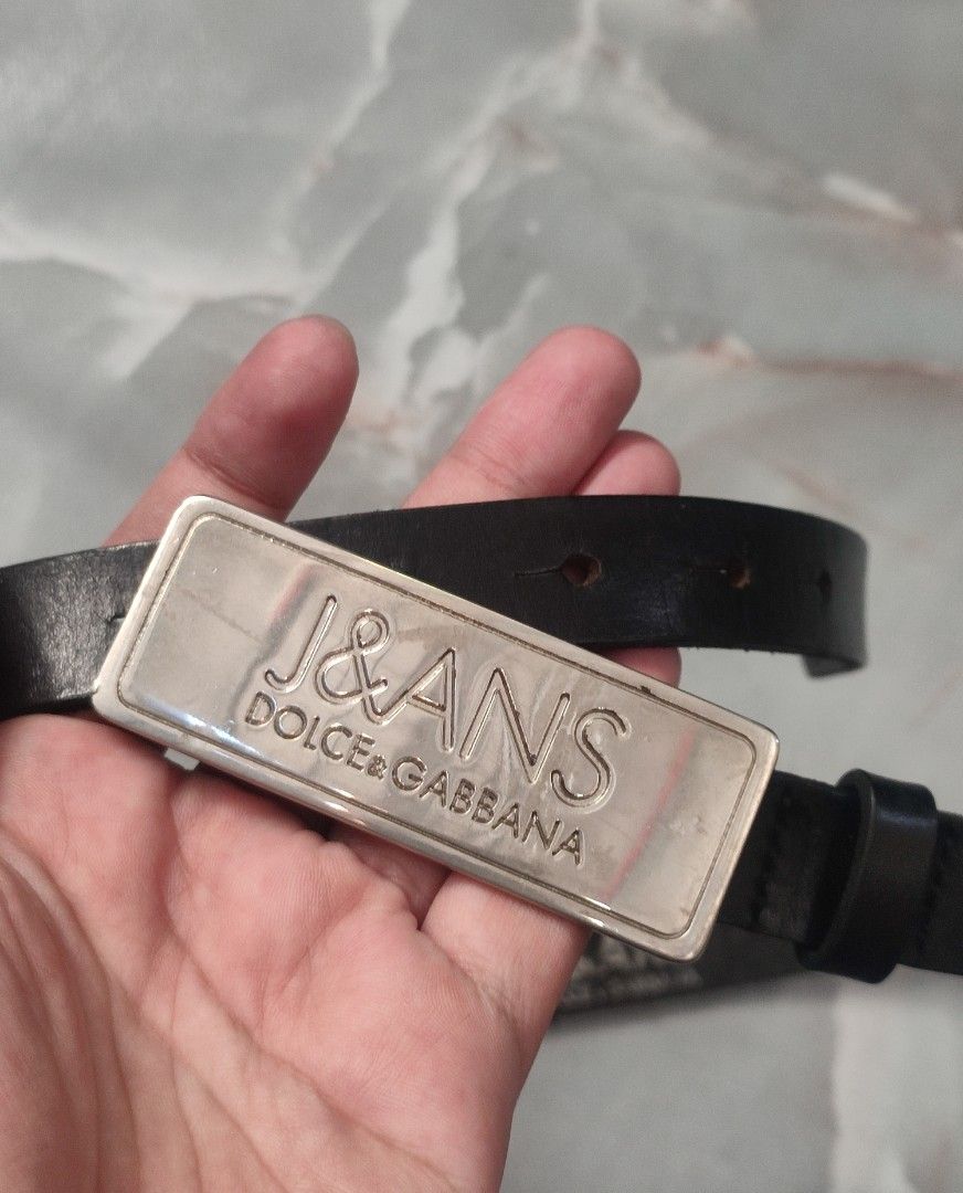 Vintage Dolce & Gabbana Leather Belt (Category: Belts) located in Taguig. Submitted by inzanne.vesture (Listing ID 1457788693, Image 1). Description: - Authentic Dolce & Gabbana belt - Size 26 - 32 Width - Color: Black leather - Buckle: Silver with J&GANS logo - Material: 100% Leather - Size: 85 - Origin: Made in Italy - Condition: Shows some wear on leather and buckle, consistent with use. Still a great statement piece..