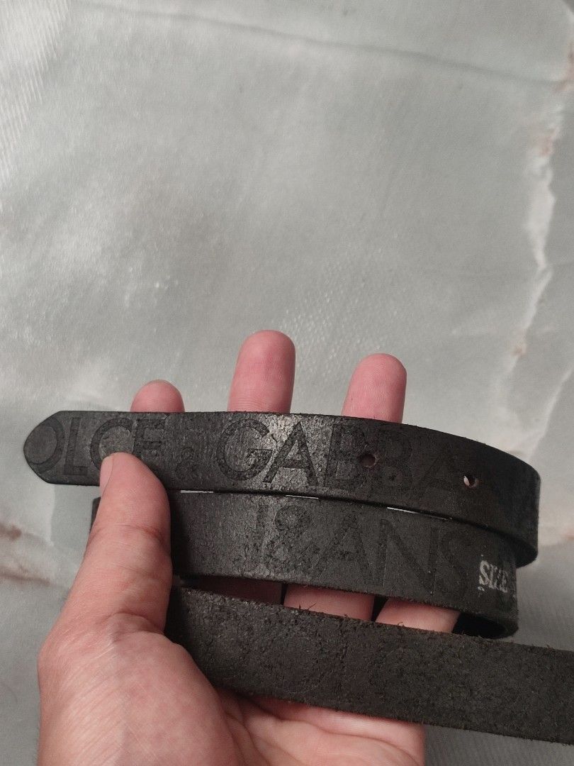 Vintage Dolce & Gabbana Leather Belt (Category: Belts) located in Taguig. Submitted by inzanne.vesture (Listing ID 1457788693, Image 3). Description: - Authentic Dolce & Gabbana belt - Size 26 - 32 Width - Color: Black leather - Buckle: Silver with J&GANS logo - Material: 100% Leather - Size: 85 - Origin: Made in Italy - Condition: Shows some wear on leather and buckle, consistent with use. Still a great statement piece..