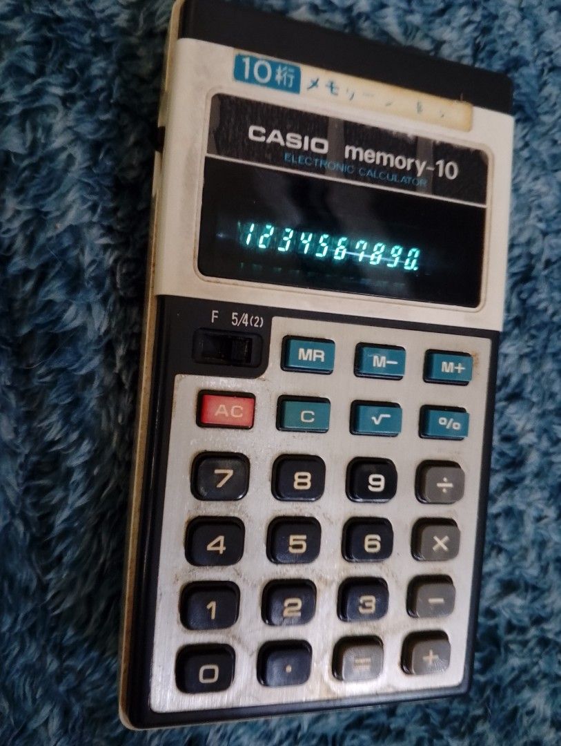 Vintage Electronic Calculators Casio National Best Bios (Category: Office & Business Technology) located in Binangonan. Submitted by stufflikedat (Listing ID 1457812618, Image 3). Description: -Vintage Casio Memory-10 electronic calculator, released in the 1970s and featuring a green vacuum fluorescent display (VFD) tube.It is a 10-digit handheld electronic calculator with dedicated memory keys (MR, M-, M+).It includes an operational mode switch 
