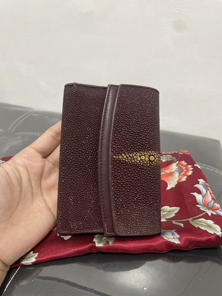 Vintage Maroon Stingray Wallet with Snap Pocket (Category: Luxury Bags & Wallets) located in Quezon City. Submitted by mjnovo (Listing ID 1457807168, Image 3). Description: Bought it at Japan thrift store. Very good condition of leather. width across when open: 10.25” width across when closed: 4” height: 5” depth: about 1.25” Contains two snaps, one pocket has a zipper with two adjacent pockets. Other snap pocket contains cash pocket and 8 credit