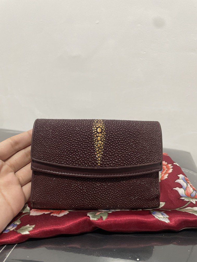 Vintage Maroon Stingray Wallet with Snap Pocket (Category: Luxury Bags & Wallets) located in Quezon City. Submitted by mjnovo (Listing ID 1457807168, Image 1). Description: Bought it at Japan thrift store. Very good condition of leather. width across when open: 10.25” width across when closed: 4” height: 5” depth: about 1.25” Contains two snaps, one pocket has a zipper with two adjacent pockets. Other snap pocket contains cash pocket and 8 credit