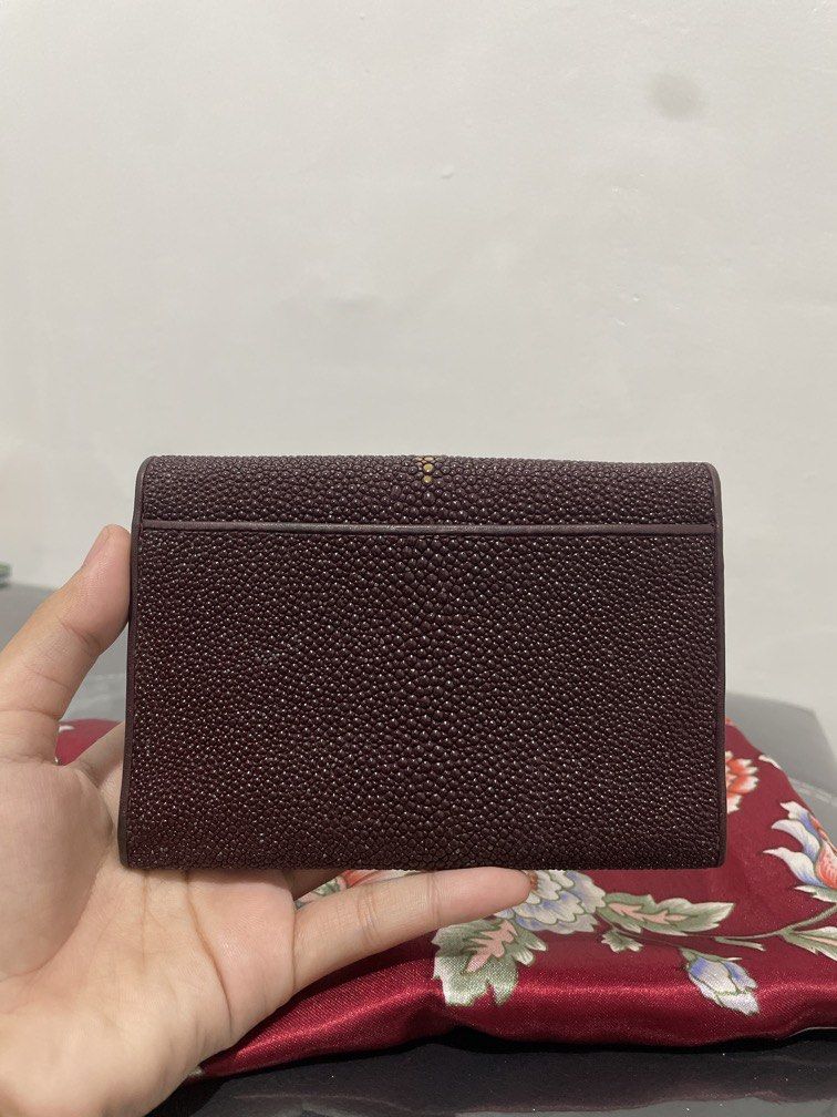 Vintage Maroon Stingray Wallet with Snap Pocket (Category: Luxury Bags & Wallets) located in Quezon City. Submitted by mjnovo (Listing ID 1457807168, Image 2). Description: Bought it at Japan thrift store. Very good condition of leather. width across when open: 10.25” width across when closed: 4” height: 5” depth: about 1.25” Contains two snaps, one pocket has a zipper with two adjacent pockets. Other snap pocket contains cash pocket and 8 credit