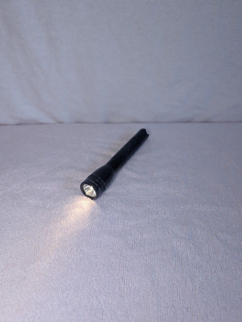 Vintage Mini Maglite Flashlight Torch (Category: Lighting) located in Marikina City. Submitted by mrtncdrc (Listing ID 1457751505, Image 1). Description: Item is working as shown on the photos. Powered by 2 AA batteries and a pair will be included upon purchase..