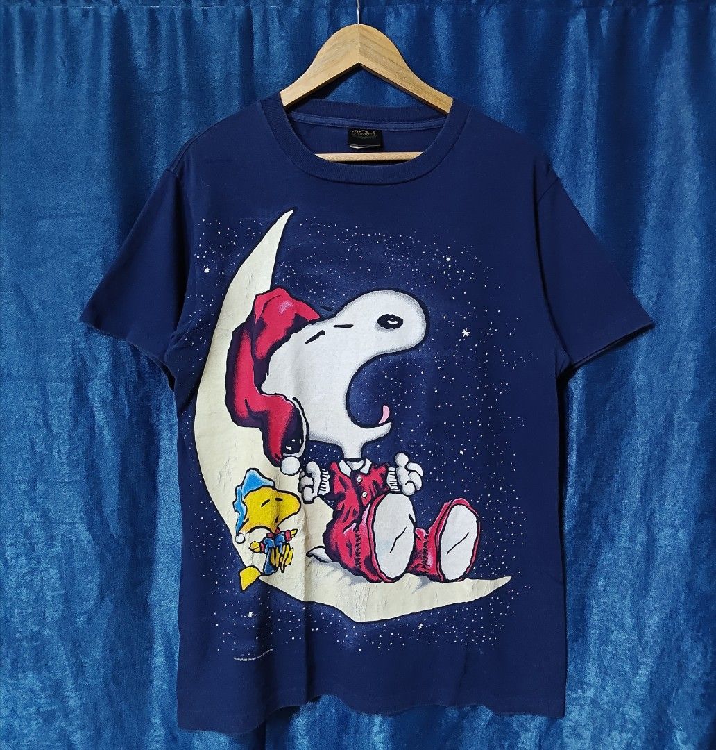 VINTAGE SNOOPY PEANUTS GLOW IN THE DARK TEE (Category: Tshirts & Polo Shirts ) located in Makati City. Submitted by upcycled.closeth (Listing ID 1457743805, Image 1). Description: - Authentic vintage snoopy peanuts product - Navy blue, Short-sleeved - Size: Medium to large (men's) - Tag: 90's Changes tag - Authentic - flaws: no flaws - Excellent condition - Need wash, fresh from bale - Features design of Snoopy peanuts glow in the dark - Material