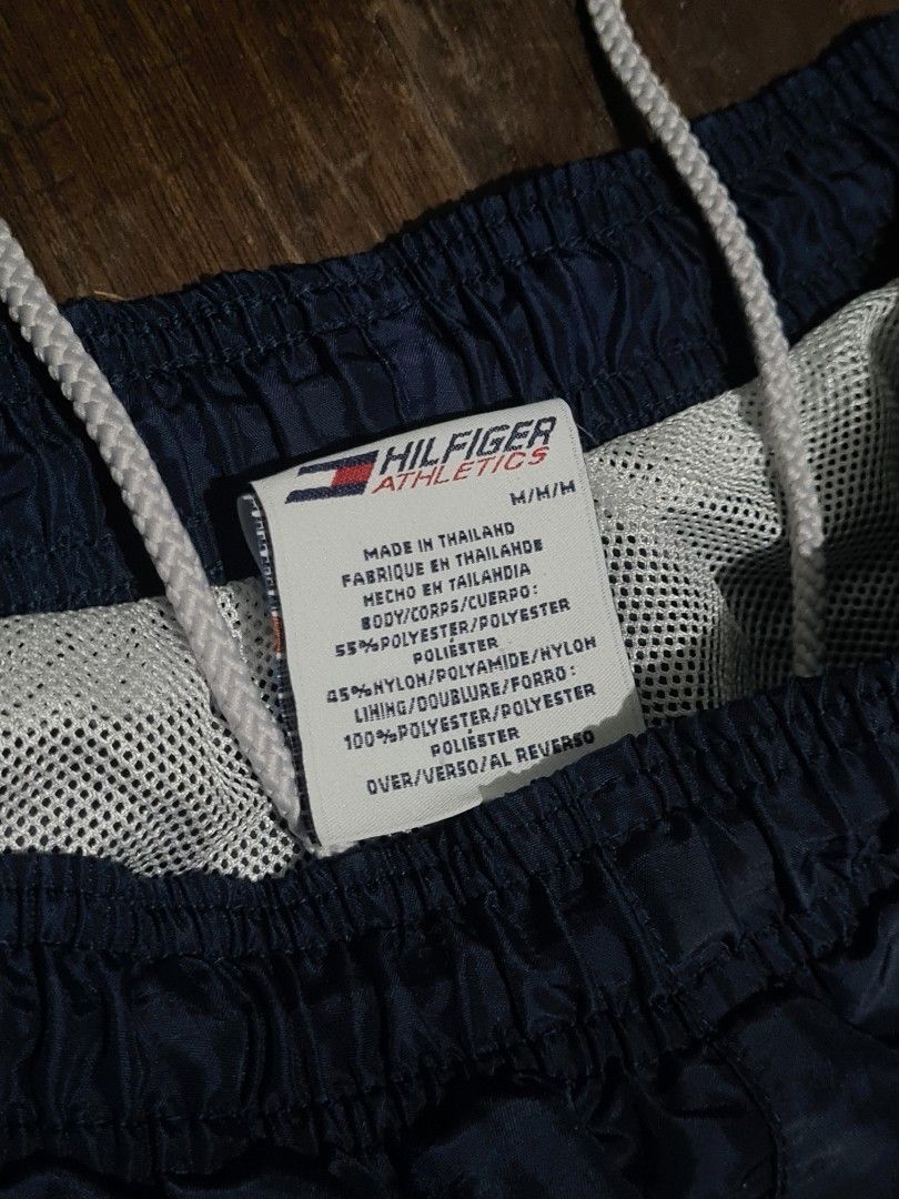 Vintage Tommy Hilfiger Track Pants (Category: Joggers) located in Pateros City. Submitted by paoef (Listing ID 1457815261, Image 3). Description: Vintage Tommy Hilfiger Hilfiger Athletics Nylon Track Pants -Size M-L -9/10 condition -Garter still crispy -2 deep pockets on the side -Silky nylon with inner mesh -NO KNOWN ISSUE W: 28-36 L: 40.5 Thighs: 13 Hem: 9.