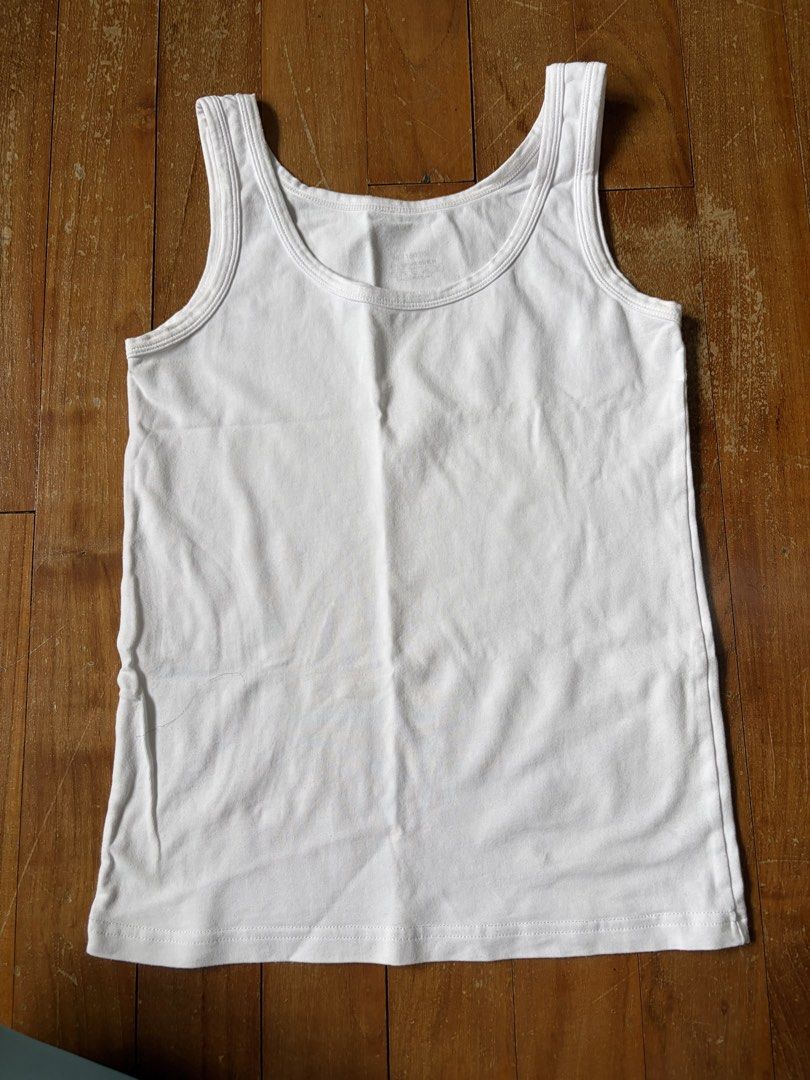 White Basic Tank Top (Category: Sleeveless) located in Singapore. Submitted by jerseyshore98 (Listing ID 1457747591, Image 1). Description: - Simple white tank top - Soft fabric for comfort - Versatile: wear on its own or layer - Wardrobe essential, easy to match.