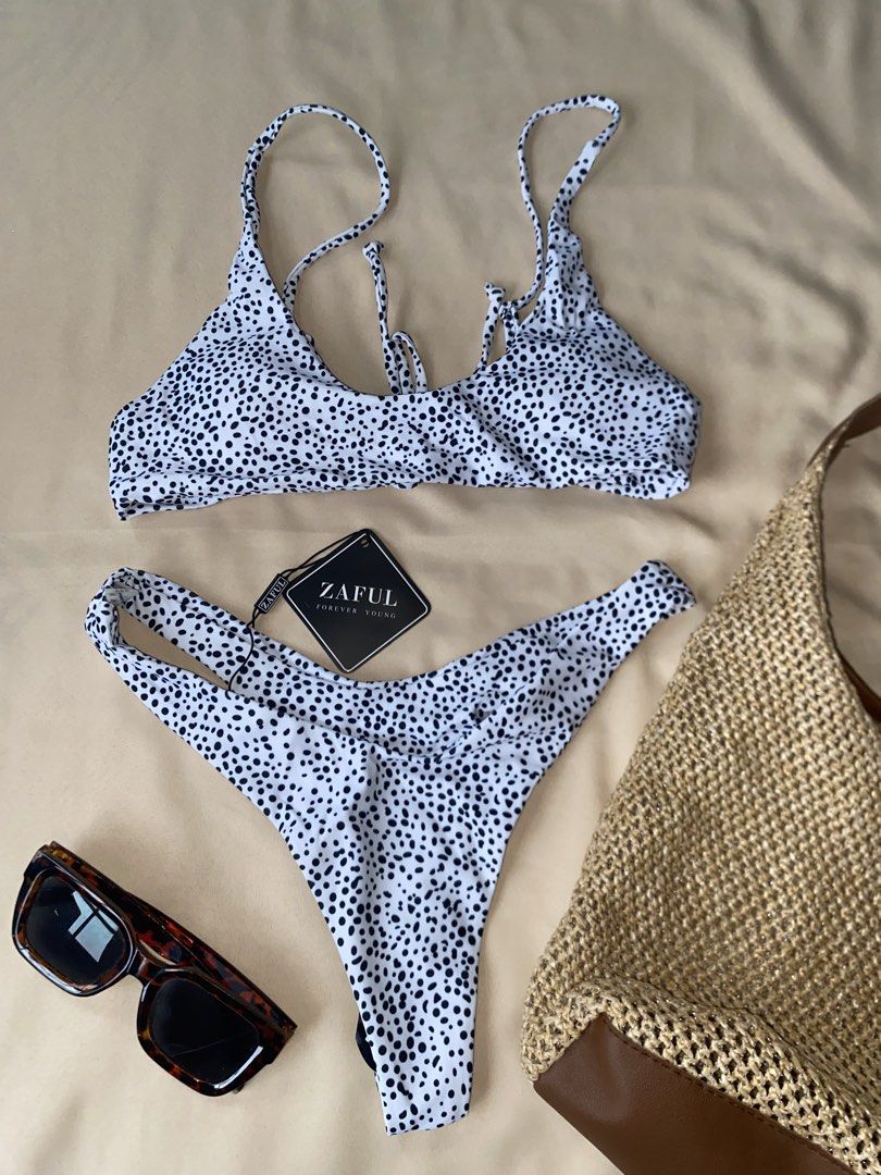 Zaful Dalmatian Print Lace-Up Bikini Set (Category: Bikinis & Swimsuits) located in Tarlac. Submitted by rieselects (Listing ID 1456579703, Image 1). Description: - Cute dalmatian print bikini set - Brand: Zaful - Features a lace-up front top - High-cut bottom - Trendy and fun print - Ideal for beach trips and pool days.
