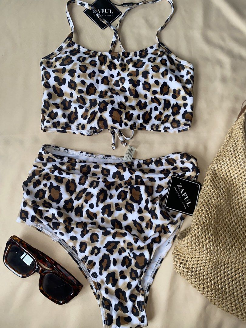 Zaful Leopard Print High Waisted Bikini Set (Category: Bikinis & Swimsuits) located in Tarlac. Submitted by rieselects (Listing ID 1456579715, Image 1). Description: - Zaful leopard print bikini set - High-waisted bottoms with flattering cut - Matching halter neck crop top - Ideal for beach vacations or pool days - Comfortable and stylish design - Guaranteed to make a statement.