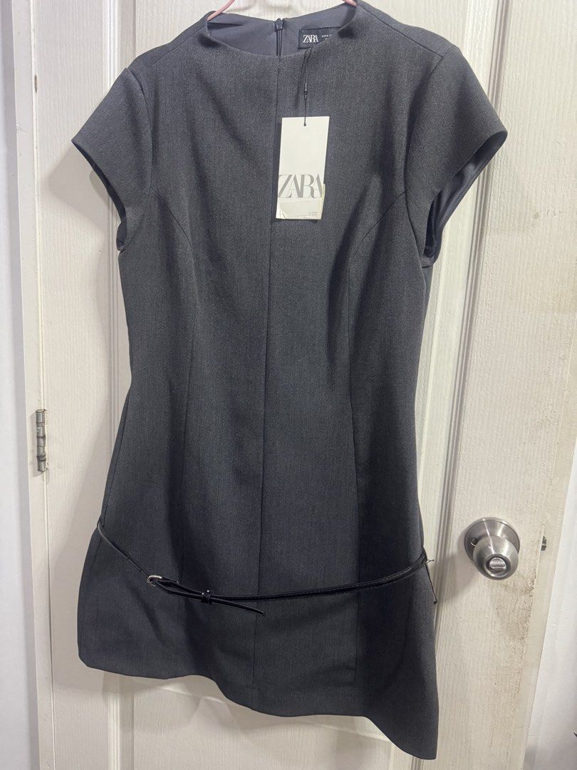 Zara Belted Mini Dress - Grey (M) (Category: Dresses) located in Manila. Submitted by reecha99736913 (Listing ID 1457834624, Image 2). Description: - Grey Zara dress - Cap sleeves - Structured fit with flared skirt - Comes with a thin black belt - Brand new with original tag attached - RFS: Not my style - Purchased for 2800 PHP overseas - Negotiable.