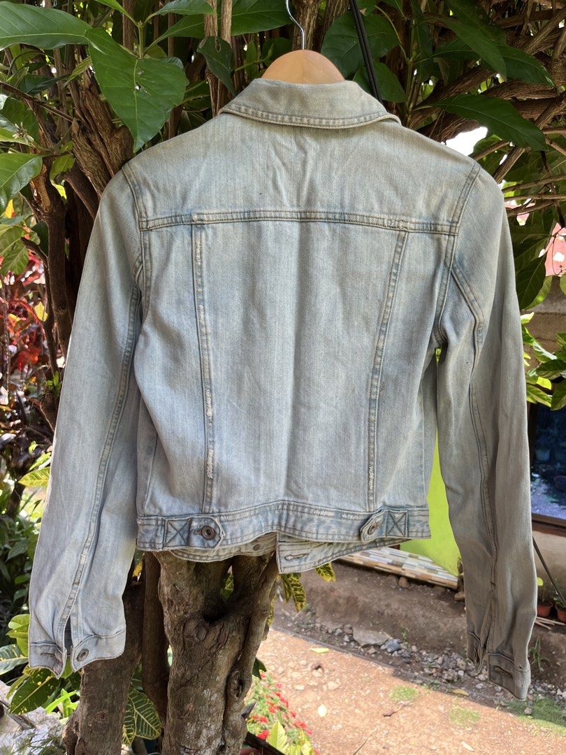 ZARA TRF Denim Jacket (Category: Coats, Jackets and Outerwear) located in Manila. Submitted by lovelynllegunas (Listing ID 1457725812, Image 2). Description: Zara TRF Denim Jacket featuring an authentic light stonewash with intentional, vintage-inspired distressing along the seams and collar. Made in 2012, this classic trucker style includes dual buttoned chest pockets and a soft, worn-in feel. Fits: Small Length: 20 Width: 15.