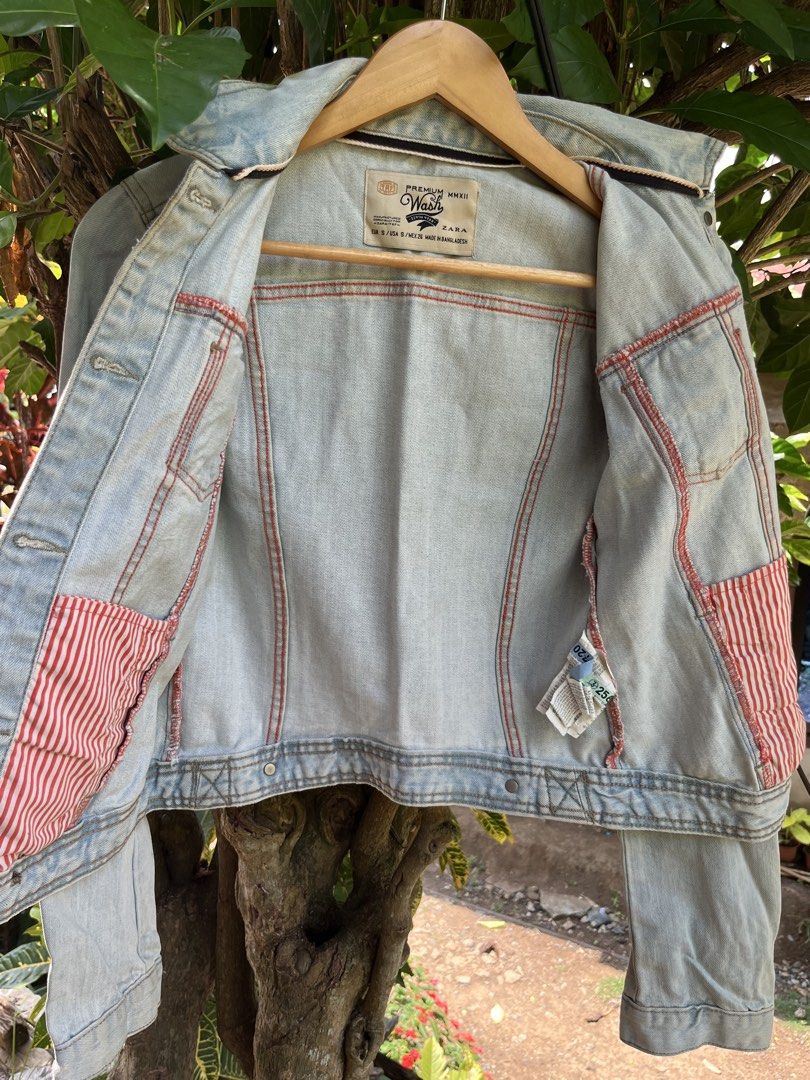 ZARA TRF Denim Jacket (Category: Coats, Jackets and Outerwear) located in Manila. Submitted by lovelynllegunas (Listing ID 1457725812, Image 3). Description: Zara TRF Denim Jacket featuring an authentic light stonewash with intentional, vintage-inspired distressing along the seams and collar. Made in 2012, this classic trucker style includes dual buttoned chest pockets and a soft, worn-in feel. Fits: Small Length: 20 Width: 15.