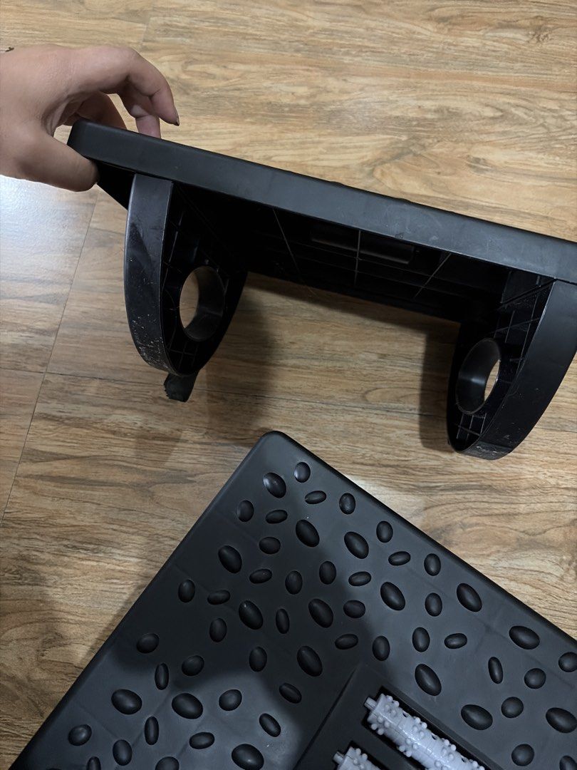 Adjustable Footrest with Massage Rollers (Category: Massage Devices) located in Makati City. Submitted by caliiiiiii (Listing ID 1457947744, Image 2). Description: -2 footrest -plastic material -good for wfh couple - Adjustable black footrest - Textured bumps for foot massage - Comes with 2 detachable massage rollers - Ideal for under-desk use.