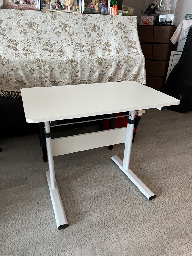 Adjustable Study Table (Category: Tables & Sets) located in Singapore. Submitted by houseofharry (Listing ID 1457941676, Image 1). Description: Height adjustable study table Table size is 80cm by 50cm.