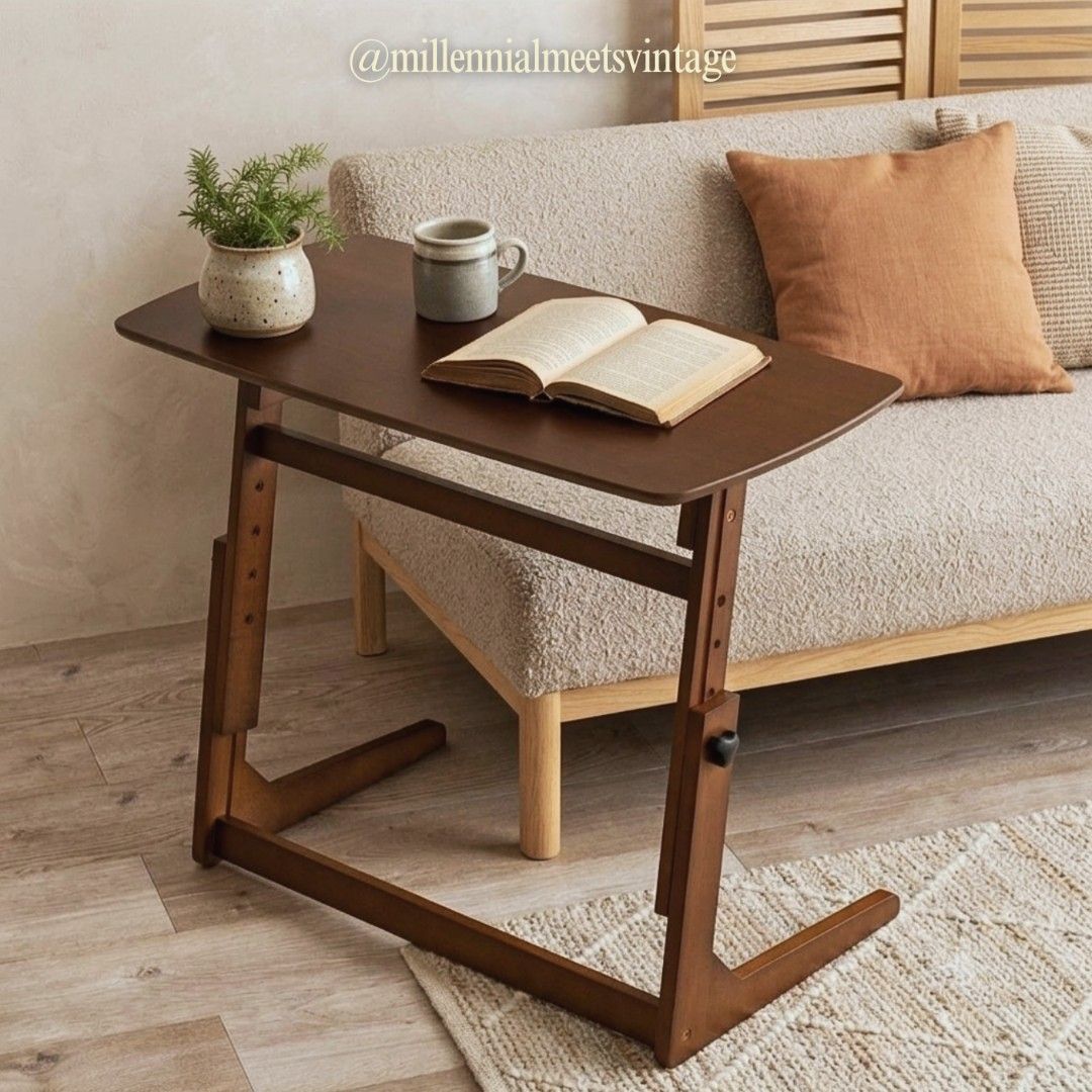 Adjustable wooden desk laptop table study desk side table (Category: Tables & Sets) located in Dasmarinas. Submitted by millennialmeetsvintage (Listing ID 1420677032, Image 1). Description: Upgrade your home with this versatile, height-adjustable wooden side table. Its smart C-shaped design slides seamlessly under your sofa or bed, making it perfect for small spaces. ⚜️Versatile use: Adjusts easily for typing, reading, or dining. ⚜️Smart design: 