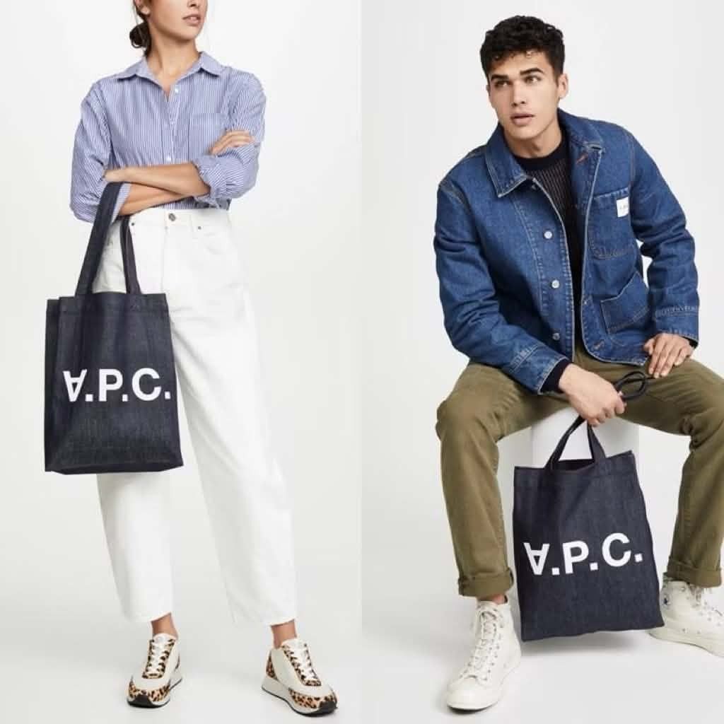 A.P.C. Logo Laure Tote Bag (Category: Tote Bags) located in Cavite. Submitted by sweetalittlemonstertoo (Listing ID 1457973646, Image 3). Description: - Classic A.P.C. tote bag - Dark denim material - White logo print - Spacious interior - Small inner pocket - Ideal for everyday use - Versatile carrying options (hand or shoulder) - Simple and stylish design.