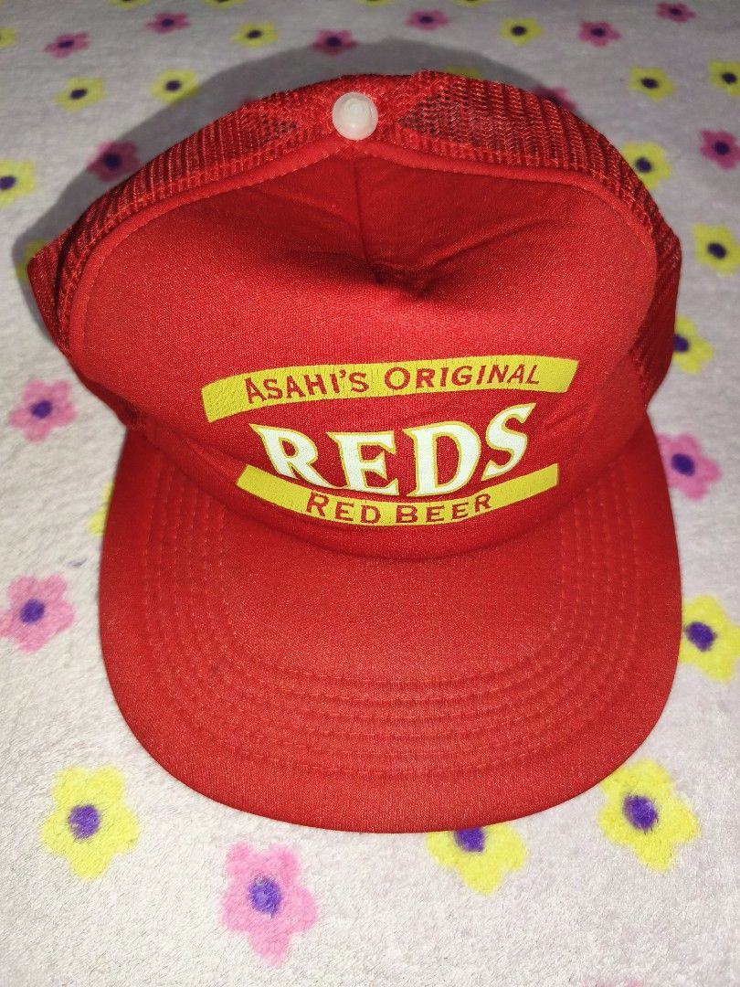 Asahi Original Reds Red Beer Trucker Cap (Category: Caps & Hats) located in Bulacan. Submitted by THA_D_THRIFT (Listing ID 1458077599, Image 1). Description: - Red trucker cap with Asahi Original Reds Red Beer logo - Mesh back for breathability - Adjustable snapback closure - Shows some signs of wear but still looks good 350 + SF.