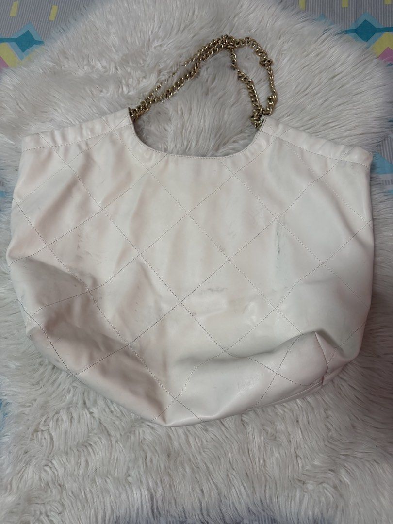 Authentic Charles & Keith Quilted Large (Category: Tote Bags) located in Taguig. Submitted by monethambas (Listing ID 1457930156, Image 2). Description: Condition: Pre-loved condition. Shows visible signs of previous use including light smudges/discoloration on the outer exterior material and minor interior lining staining near the base/seams (please refer to photos for details). Hardware, chain handles, and zipper function smoothly..