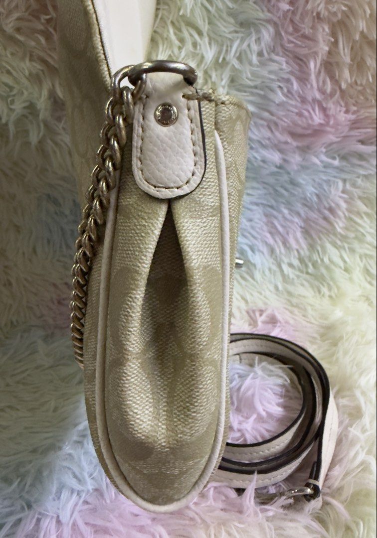 Authentic Coach Mini Ruby Crossbody Bag — Signature Canvas (Category: Luxury Bags & Wallets) located in Rizal. Submitted by affordabagz (Listing ID 1457977321, Image 2). Description: ✅ Details & Condition: • Material: Signature coated canvas + leather trim • Hardware: Gold-tone turnlock closure + chain detail • ✔️ 2 straps included: decorative chain strap + detachable leather crossbody strap — versatile styling! • Features: Front flap turnlock, i