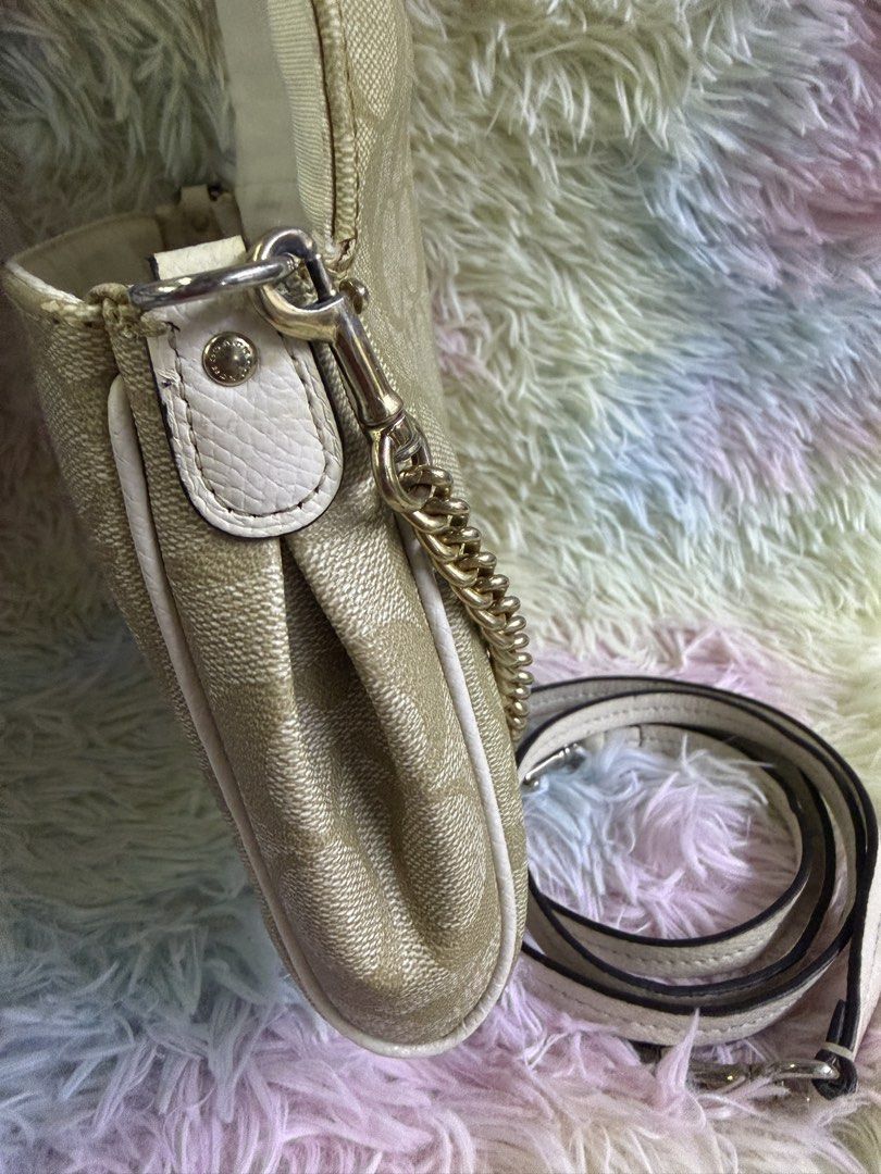 Authentic Coach Mini Ruby Crossbody Bag — Signature Canvas (Category: Luxury Bags & Wallets) located in Rizal. Submitted by affordabagz (Listing ID 1457977321, Image 3). Description: ✅ Details & Condition: • Material: Signature coated canvas + leather trim • Hardware: Gold-tone turnlock closure + chain detail • ✔️ 2 straps included: decorative chain strap + detachable leather crossbody strap — versatile styling! • Features: Front flap turnlock, i