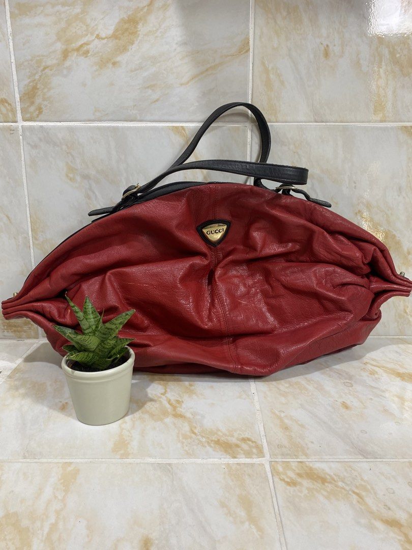 Authentic Red Lips Leather Gucci Handbag (Category: Luxury Bags & Wallets) located in Manila. Submitted by haveago0dthrift (Listing ID 1457960534, Image 1). Description: - Authentic red leather Gucci handbag - Black leather straps and trim - Zipper closure - Black interior lining - A classic Gucci piece.