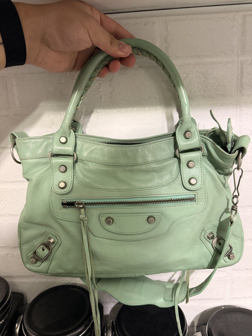 Balenciaga City - Mint Green Leather (Category: Luxury Bags & Wallets) located in Taguig. Submitted by luxeria_ (Listing ID 1458031331, Image 1). Description: - Balenciaga Part Time bag - mint green color -Lampo zipped -coded -with metal plate -negotiable.