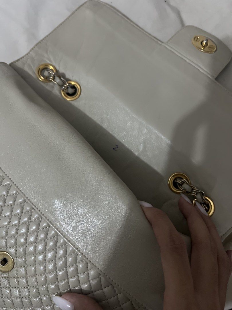 Bally Quilted Leather Shoulder Bag (Category: Luxury Bags & Wallets) located in Legazpi City. Submitted by gleh1 (Listing ID 1458071324, Image 3). Description: Faded on the hardwares Clean interior Beige or Grey color Small pen mark stain Length: 11 inches Height: 8 inches .