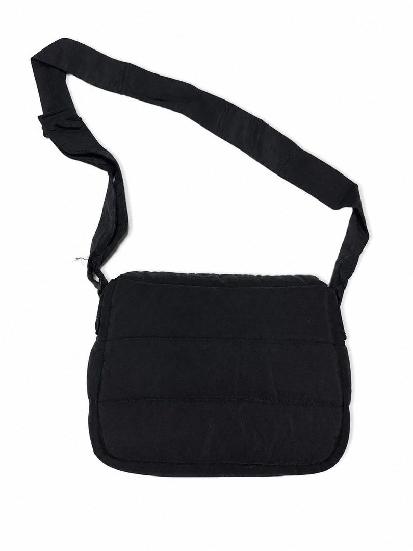 Beyond The Vines Poofy Bag Black (Category: Cross-body Bags) located in Bacoor. Submitted by sofaritsalright (Listing ID 1457968042, Image 2). Description: - Brand: Beyond The Vines - Orignal price: 3,790 - Bought from Singapore - Color: Black - Style: Puffer crossbody bag - Condition: Great for everyday use - Features: Plenty of space inside, adjustable strap - Includes: Original dust bag.
