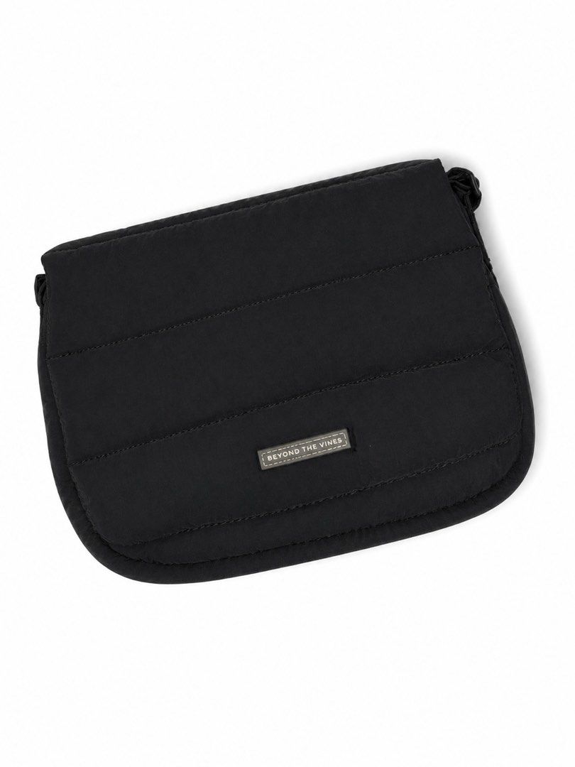 Beyond The Vines Poofy Bag Black (Category: Cross-body Bags) located in Bacoor. Submitted by sofaritsalright (Listing ID 1457968042, Image 1). Description: - Brand: Beyond The Vines - Orignal price: 3,790 - Bought from Singapore - Color: Black - Style: Puffer crossbody bag - Condition: Great for everyday use - Features: Plenty of space inside, adjustable strap - Includes: Original dust bag.