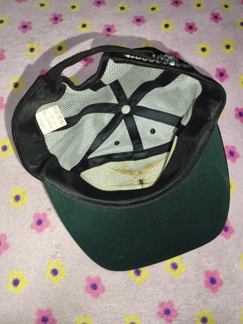 Black Air Wing Baseball Cap with Gold Embroidery (Category: Caps & Hats) located in Bulacan. Submitted by THA_D_THRIFT (Listing ID 1458077207, Image 2). Description: - Classic black baseball cap - Features intricate gold embroidery - Design includes an eagle and plane motif - 'Air Wing' text detail - Laurel leaf accents on the brim - Adjustable strap for a comfortable fit - Ideal for everyday style or as a collector's item 650 + SF.