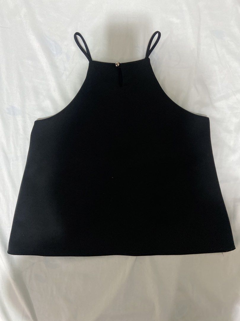 Black Halter Neck Sleeveless Top (Category: Sleeveless) located in San Juan City. Submitted by prettysecondlife (Listing ID 1458046111, Image 2). Description: Black Halter Neck Sleeveless Top 🖤 Simple and versatile black halter neck top with a sleeveless design and button closure at the back of the neck. Estimated size M. Easy to style on its own or layer with other pieces—perfect for any outfit! .