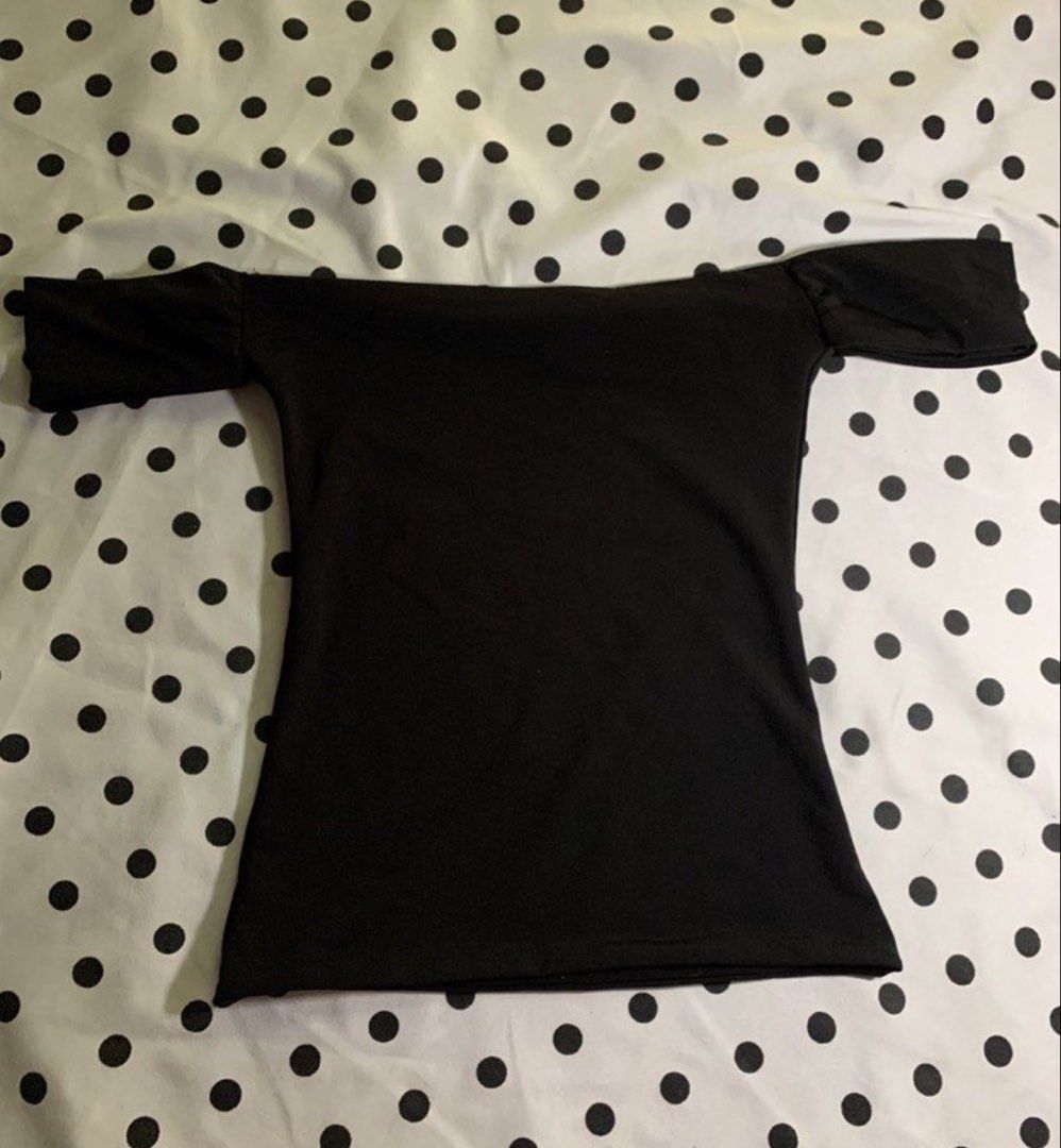 Black Off-Shoulder Mera Alana (Category: Blouses) located in Manila. Submitted by shaee__ (Listing ID 1458072849, Image 1). Description: - Chic black off-shoulder design - Comfortable short sleeves - Stretchy fabric for a great fit - Versatile: perfect for casual outings or dressing up - Effortlessly pairs with any bottoms.