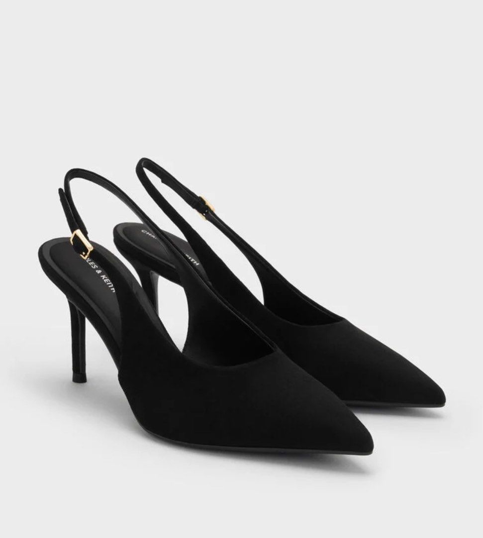 Black Slingback Heels (Category: Heels) located in Las Pinas. Submitted by jjjlb (Listing ID 1458052646, Image 1). Description: Size: 37 - Classic black slingback heels by Charles & Keith - Elegant pointed toe design - Adjustable strap with a stylish gold buckle - Comfortable heel height, suitable for daily wear or events - Highly versatile, pairs well with any outfit Bought Aug 26,2027 for 3,599 Used once during my husband's graduation.