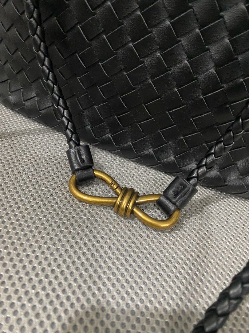 Black Woven Leather Handbag with Gold Hardware (Category: Shoulder Bags) located in Bacoor. Submitted by hallumae (Listing ID 1457995402, Image 2). Description: Metal clasp for closure With zipper pocket inside for important belongings Strap can be adjusted Can fit two phones, powerbank, wallet, alcohol, etc Width- 25.5cm Height-18.5cm .