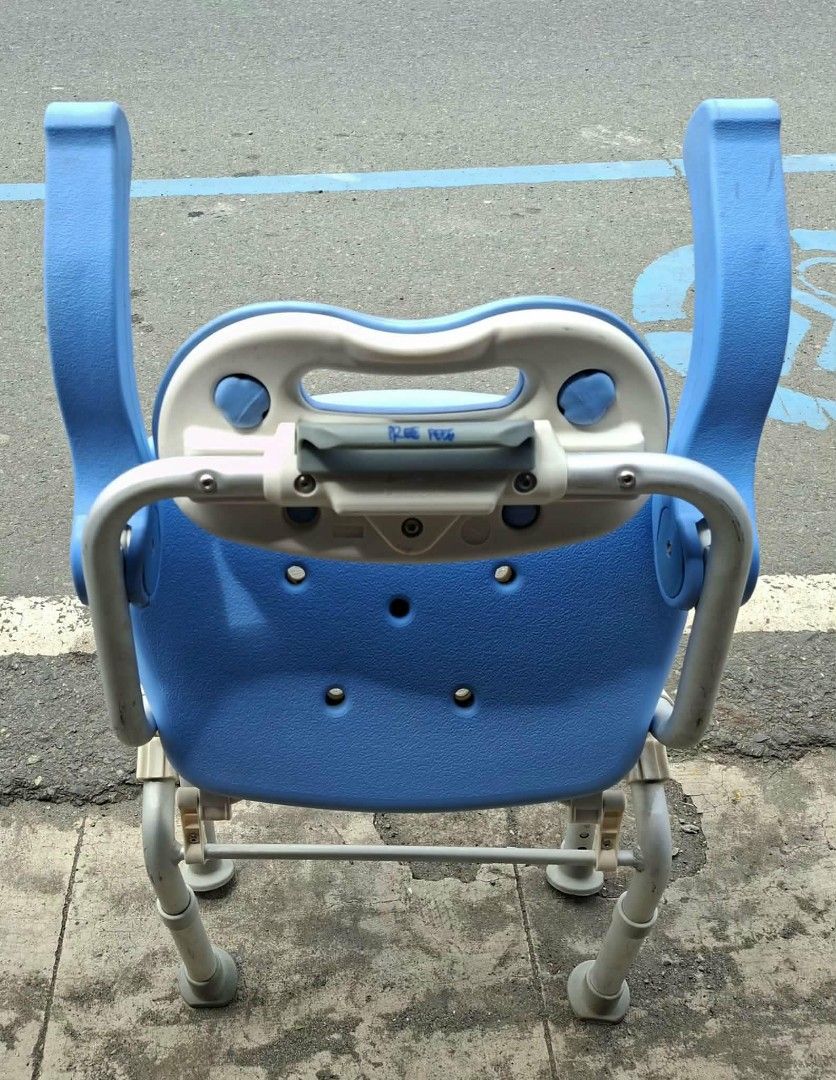 Blue Shower Chair with Backrest and Arms (Category: Chairs) located in Manila. Submitted by rocksolid227 (Listing ID 1457954185, Image 2). Description: - Blue shower chair with backrest and armrests - Features drainage holes on the seat - Sturdy metal frame for durability - Adjustable height legs for customized fit - Designed for enhanced bathroom safety - Made with easy-to-clean material.