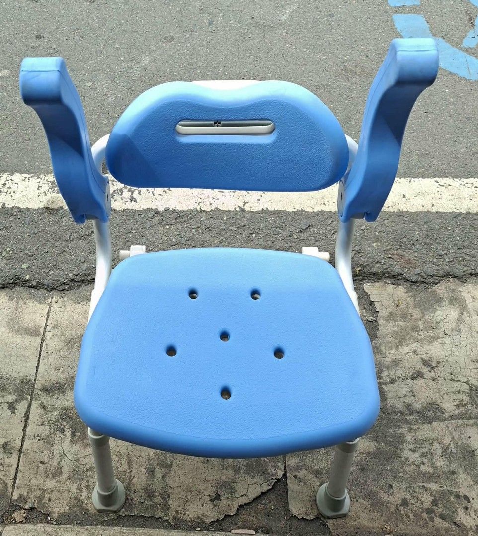 Blue Shower Chair with Backrest and Arms (Category: Chairs) located in Manila. Submitted by rocksolid227 (Listing ID 1457954185, Image 1). Description: - Blue shower chair with backrest and armrests - Features drainage holes on the seat - Sturdy metal frame for durability - Adjustable height legs for customized fit - Designed for enhanced bathroom safety - Made with easy-to-clean material.