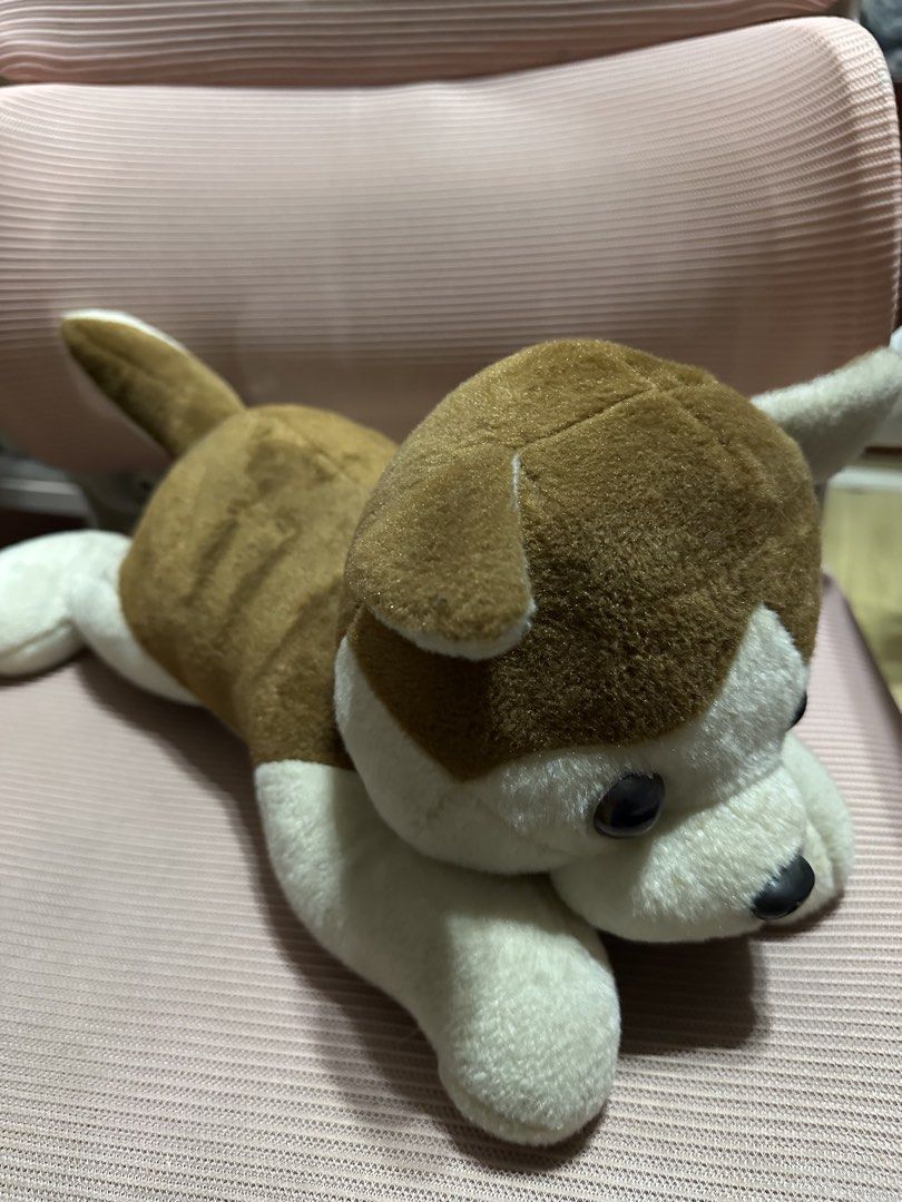 Brown and White Dog Plush Toy (Category: Plushies & Soft Toys) located in Dasmarinas. Submitted by maecybee (Listing ID 1458004778, Image 1). Description: - Adorable brown and white plush dog toy. - Features a cute lying down pose. - Super soft and cuddly, perfect for kids. - Also great as a charming decoration..