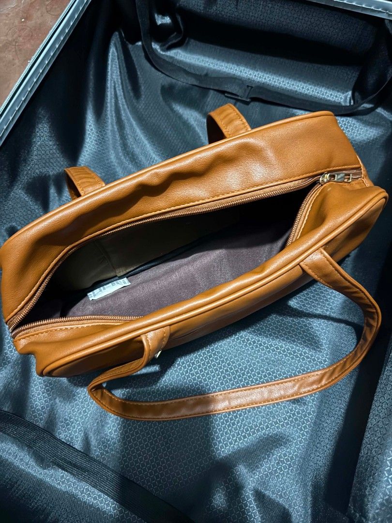 Brown Shoulder Bag with Zipper Pocket (Category: Shoulder Bags) located in Pasay City. Submitted by liveturtle0424 (Listing ID 1457969988, Image 2). Description: - no issue - brown shoulder bag - Spacious main compartment with zipper closure - Convenient zippered pocket on the back.