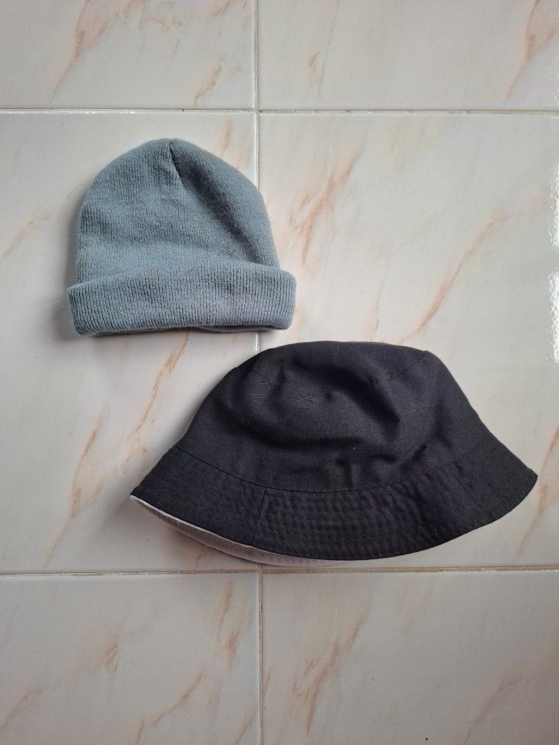 BUNDLE! Gray Knitted Beanie & Reversible Bucket Hat (Black and White) (Category: Caps & Hats) located in Cavite. Submitted by graciously_good (Listing ID 1447752429, Image 1). Description: - This is only two hats - Gray beanie for baguio or cold weather - Reversible bucket hat — white and black - Both were used once - Yellow stains from years of being stored RFS: Declutter, not my style.