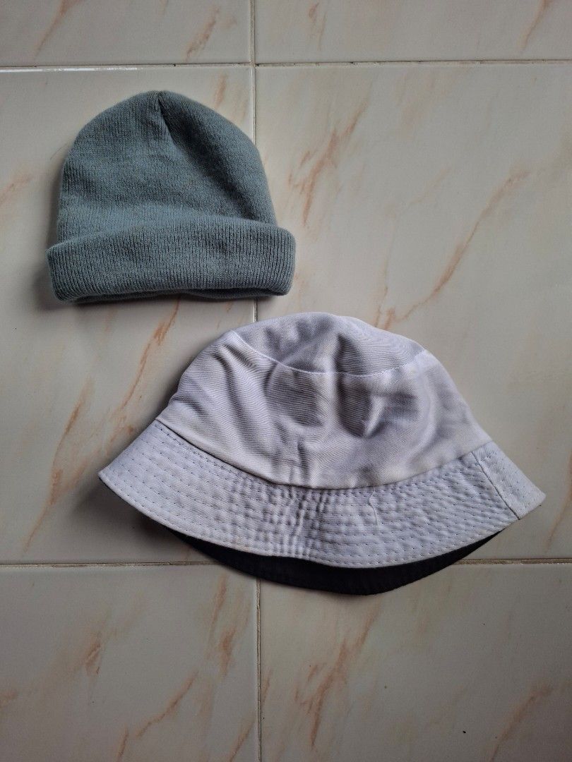 BUNDLE! Gray Knitted Beanie & Reversible Bucket Hat (Black and White) (Category: Caps & Hats) located in Cavite. Submitted by graciously_good (Listing ID 1447752429, Image 2). Description: - This is only two hats - Gray beanie for baguio or cold weather - Reversible bucket hat — white and black - Both were used once - Yellow stains from years of being stored RFS: Declutter, not my style.