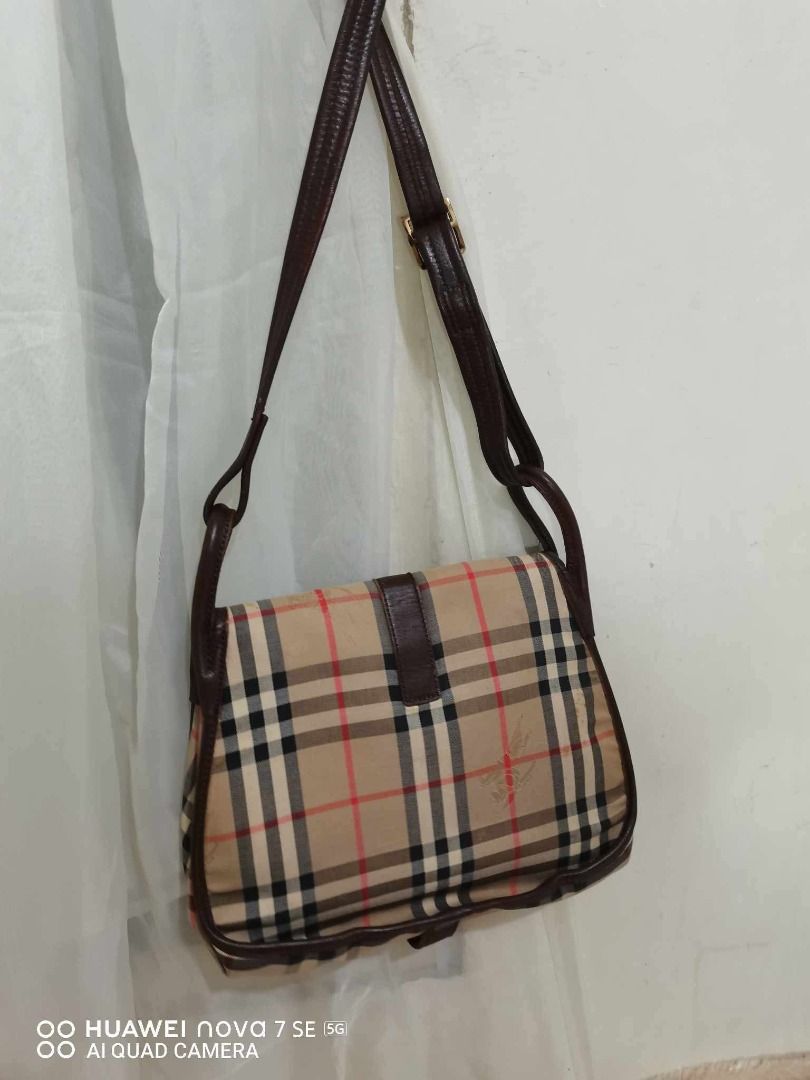 Burberry Nova Check Shoulder Bag (Category: Luxury Bags & Wallets) located in Caloocan City. Submitted by refreshmycloset444 (Listing ID 1458078586, Image 2). Description: - Classic Burberry shoulder bag - Iconic Nova Check pattern - Leather trim and strap - Gold hardware detail - Interior zip pocket - Great everyday bag - Shows some signs of wear on leather trim and strap.