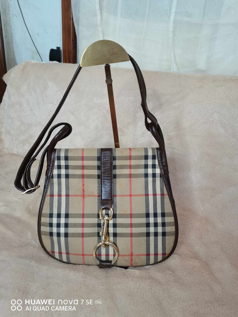 Burberry Nova Check Shoulder Bag (Category: Luxury Bags & Wallets) located in Caloocan City. Submitted by refreshmycloset444 (Listing ID 1458078586, Image 3). Description: - Classic Burberry shoulder bag - Iconic Nova Check pattern - Leather trim and strap - Gold hardware detail - Interior zip pocket - Great everyday bag - Shows some signs of wear on leather trim and strap.
