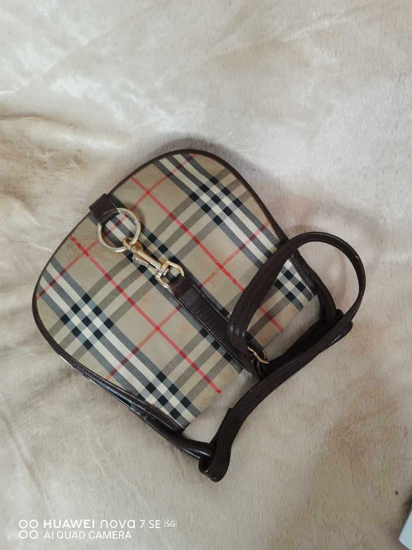 Burberry Nova Check Shoulder Bag (Category: Luxury Bags & Wallets) located in Caloocan City. Submitted by refreshmycloset444 (Listing ID 1458078586, Image 1). Description: - Classic Burberry shoulder bag - Iconic Nova Check pattern - Leather trim and strap - Gold hardware detail - Interior zip pocket - Great everyday bag - Shows some signs of wear on leather trim and strap.
